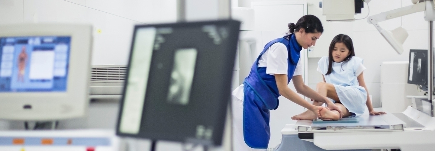 doctor prepping a young girl for a medical procedure